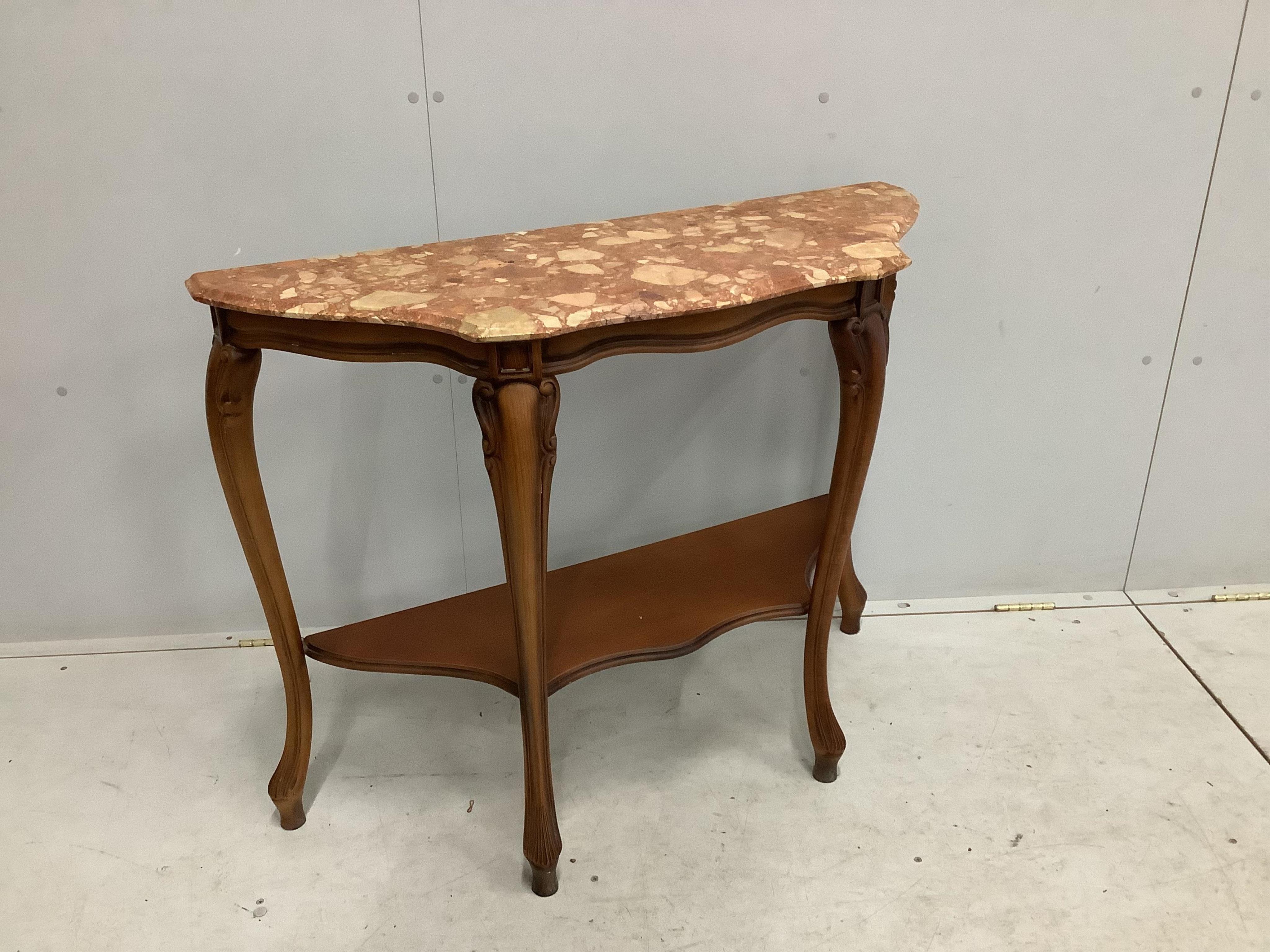 A Louis XVI style walnut serpentine marble topped two tier console table, width 100cm, depth 36cm, height 78cm. Condition - good